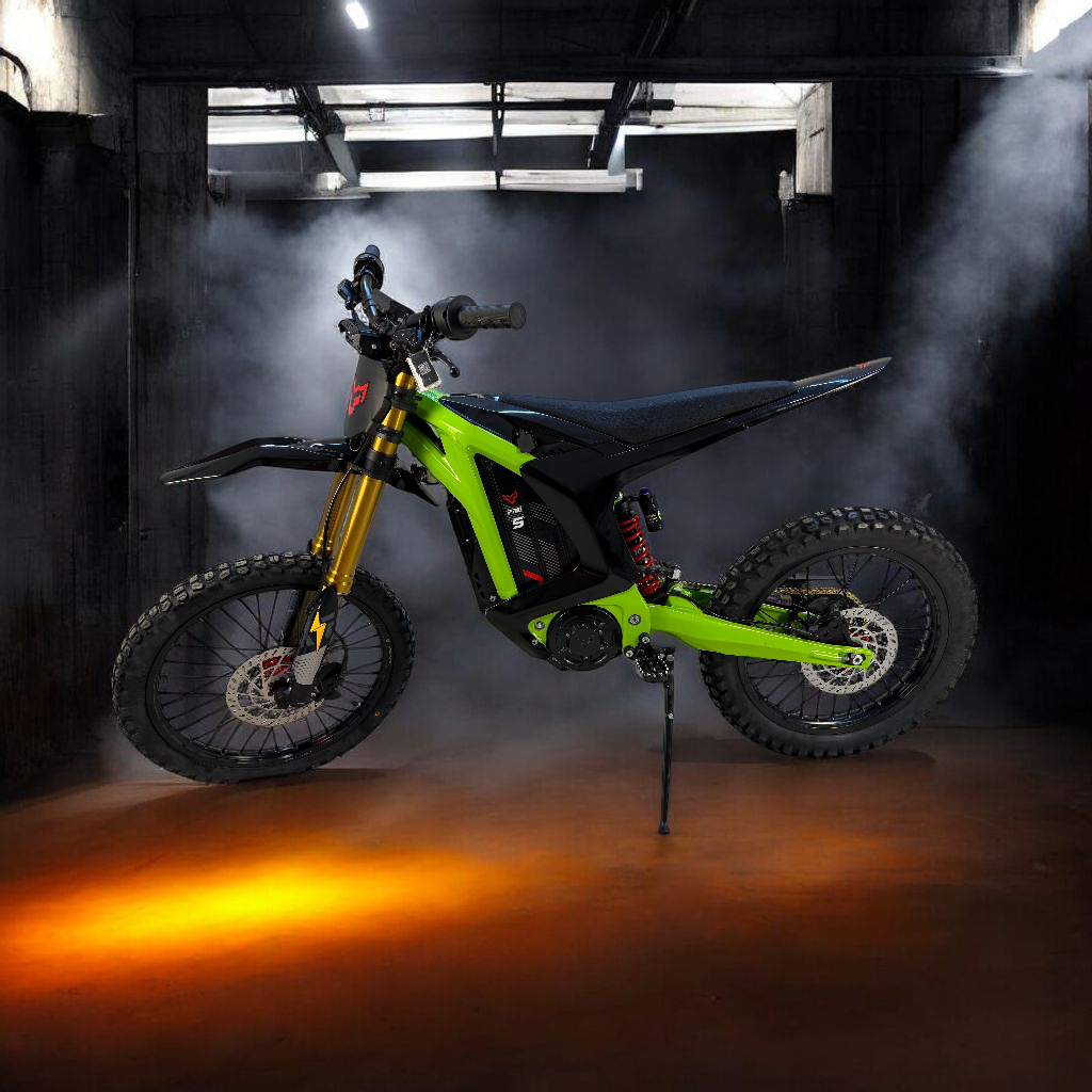 A sleek green and black electric dirt bike with gold front forks and red wheel accents, set on a high-clearance frame, surrounded by a misty, fog-filled background.