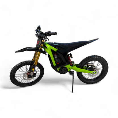 A sleek, green and black electric dirt bike with gold front forks and red wheel accents on a high-clearance frame.
